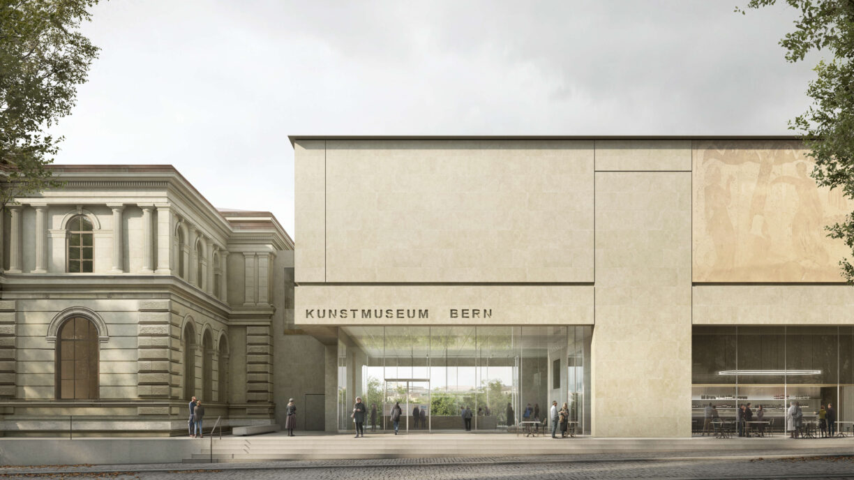 Front of the new Kunstmuseum Bern with the street and a transparent entrance that allows the view of the green behind