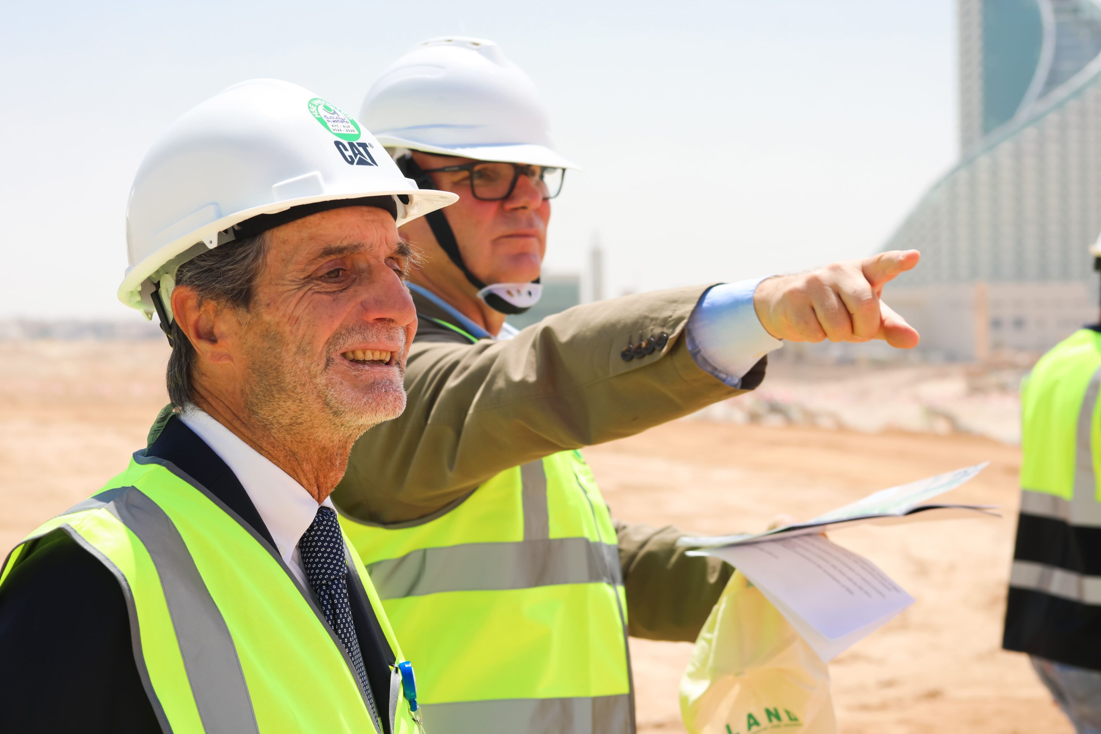 2 middle aged men with construction site helmets and waistcoat, Attilio Fontana and Andreas Kipar