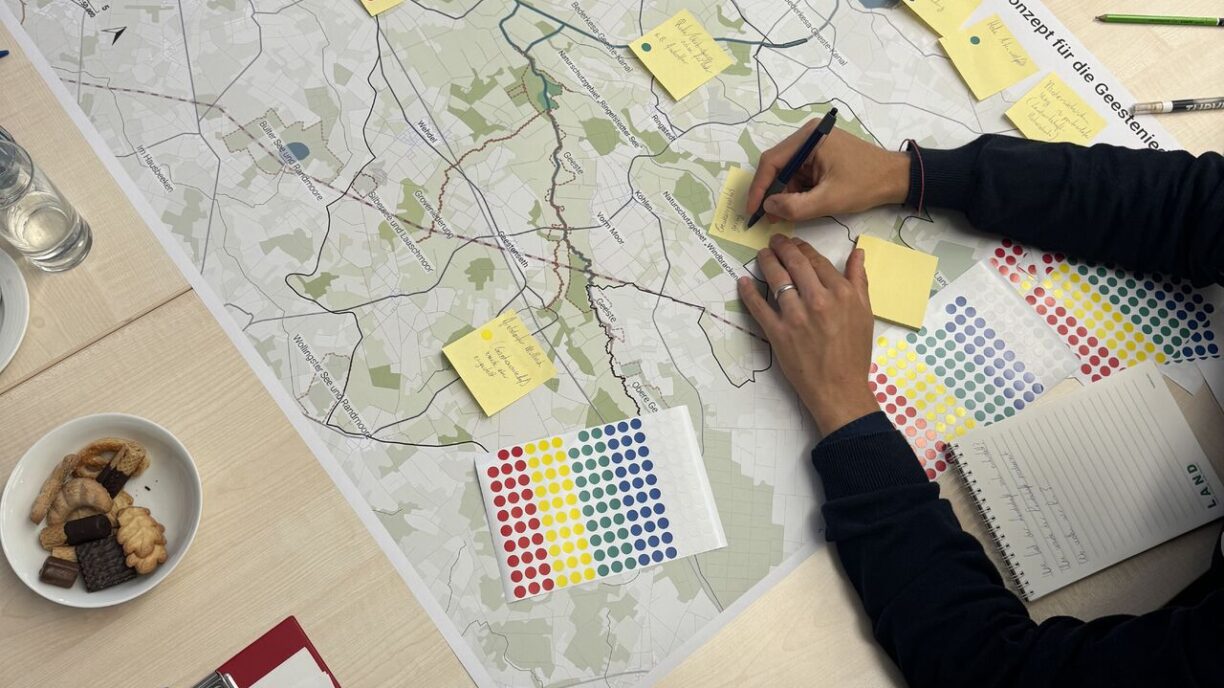 A table with post-its on a map for a planning workshop